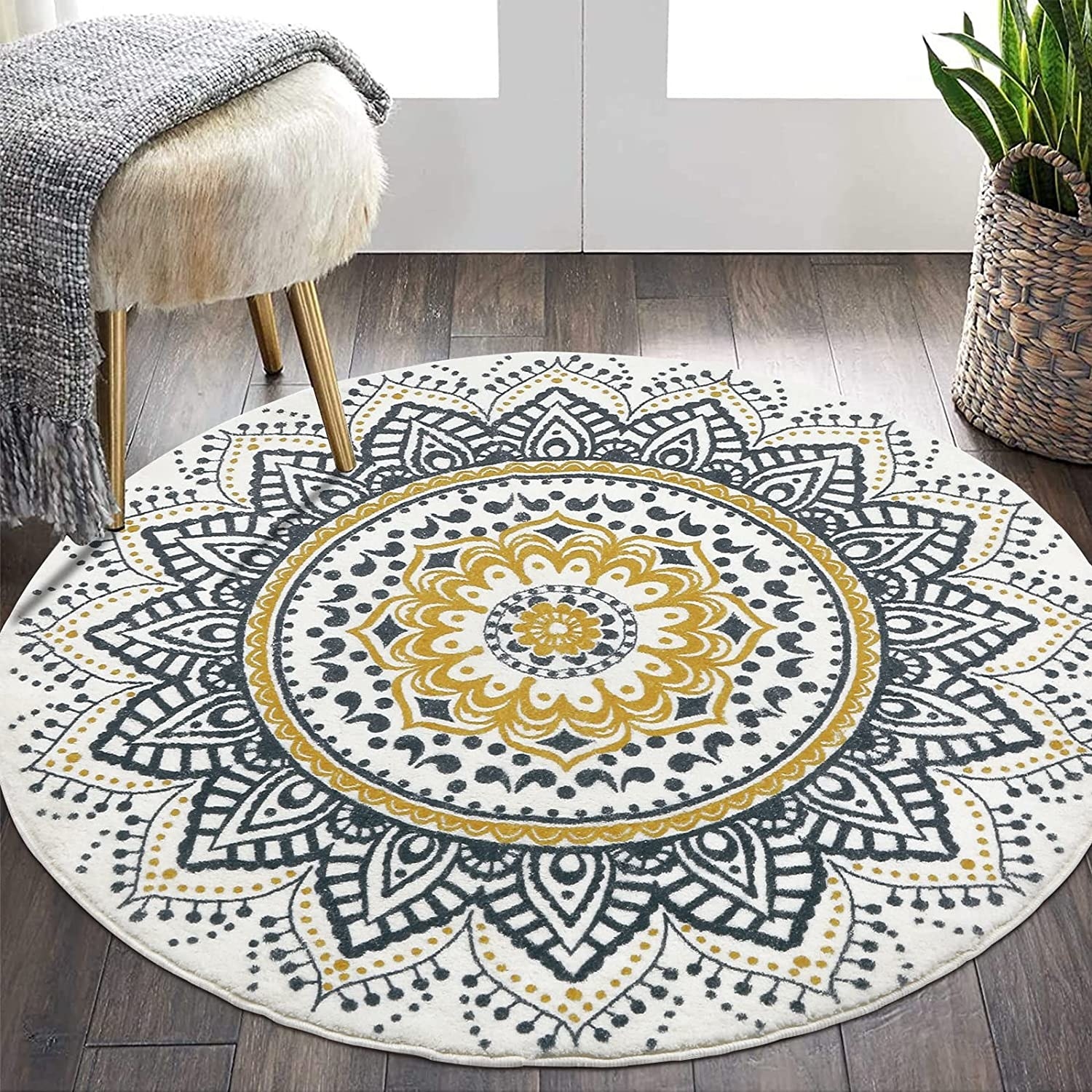 A round area rug with a mandala pattern