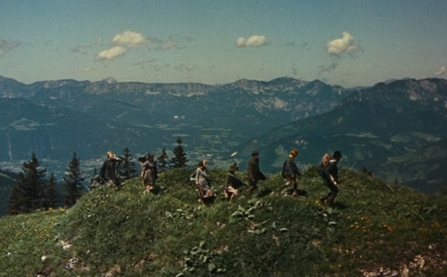 The von Trapps walk together in the Alps