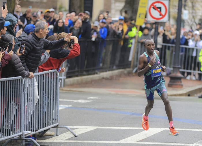 Evans Chebet rounds one of the final corners en route to his second straight Boston Marathon victory.