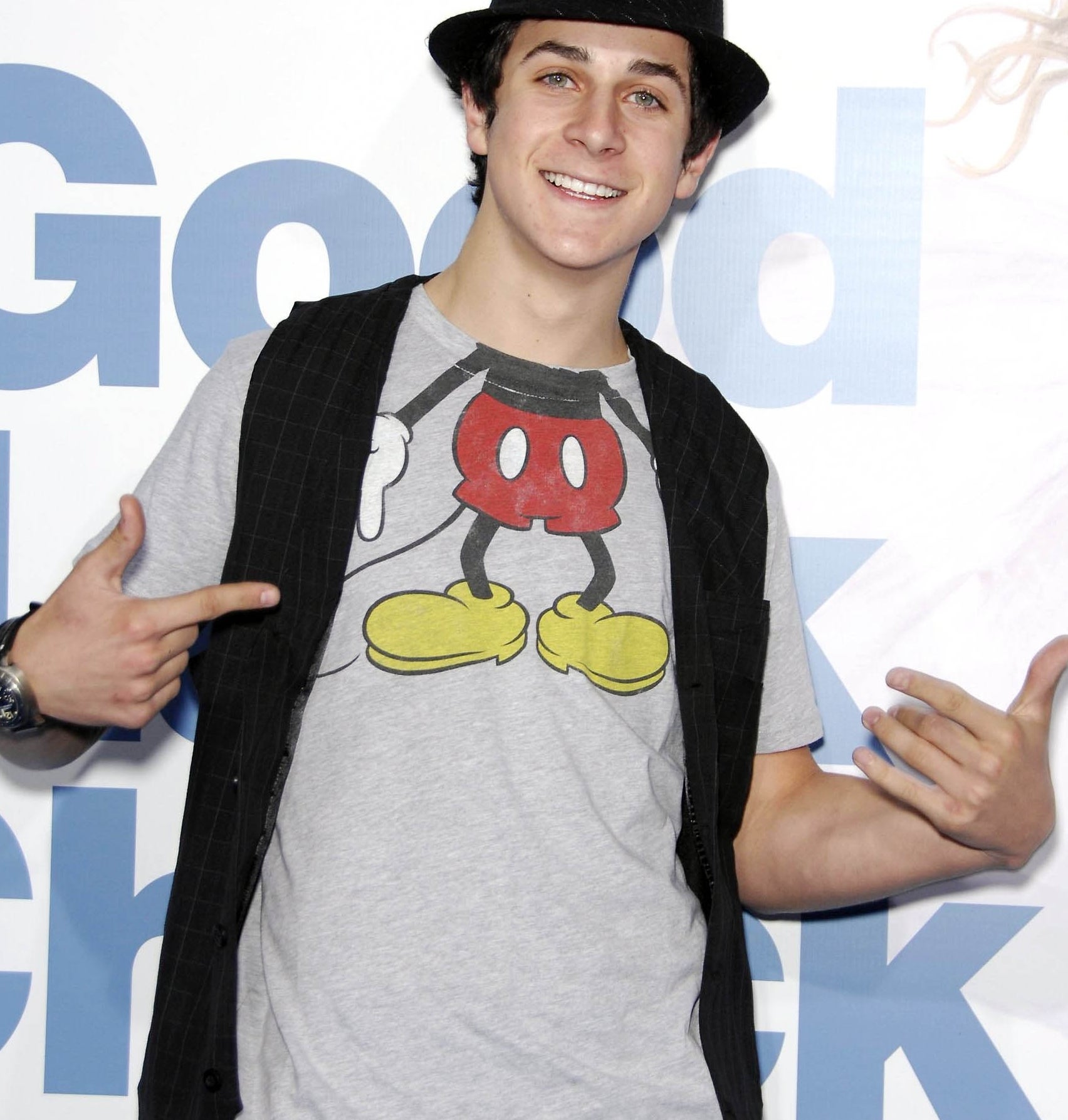 young person wearing a fedora