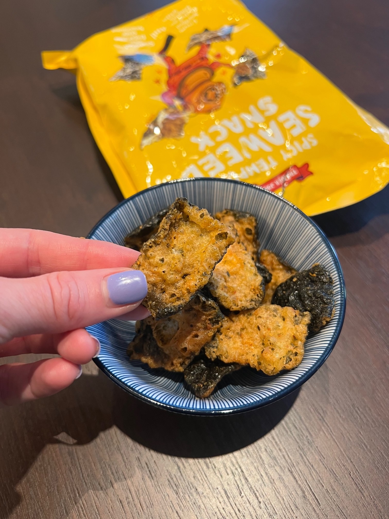 A bowl of tempura seaweed snacks.