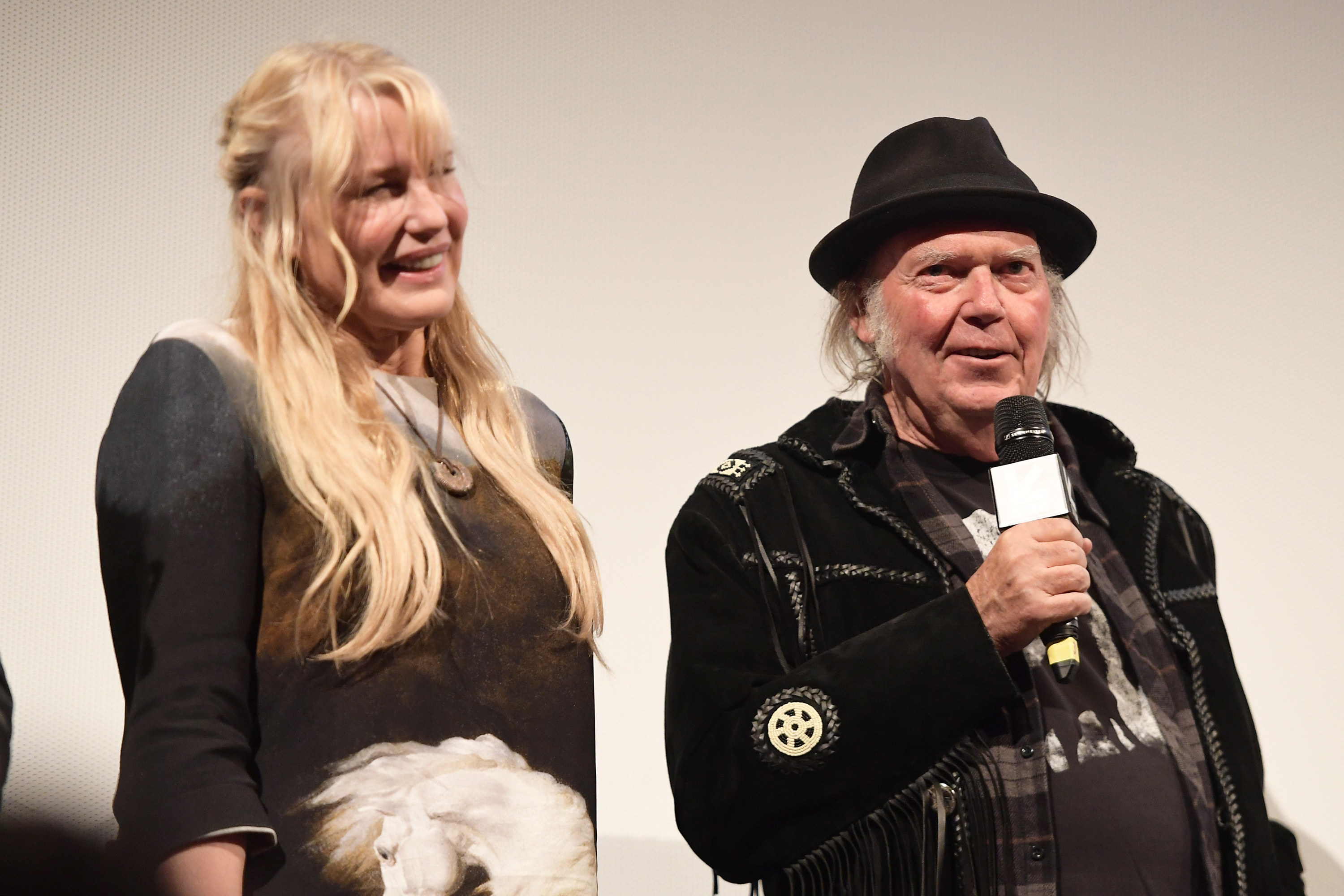 Daryl Hannah and Neil Young smiling together in 2018