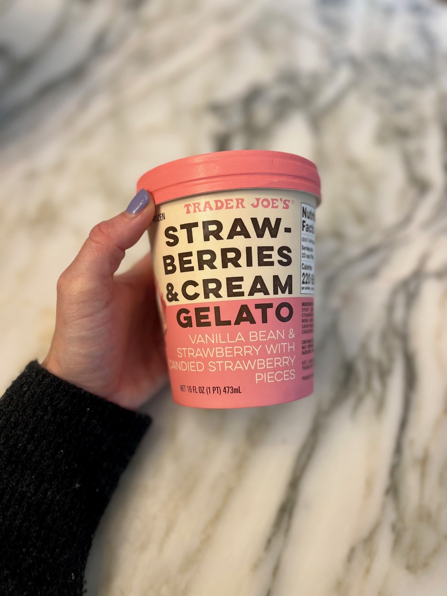 A pint of strawberries and cream gelato.