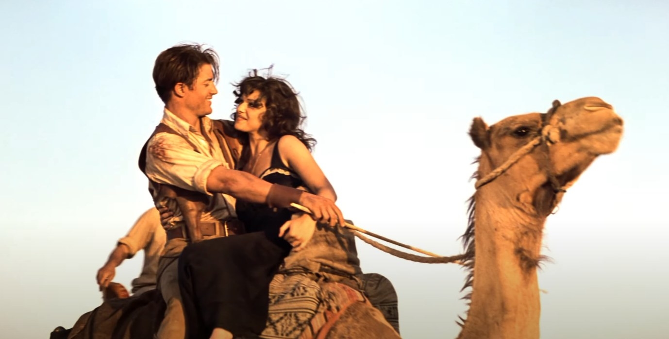 Rick and Evelyn ride on a camel together