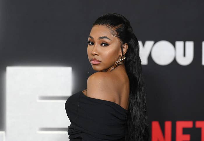 Yung Miami looking over her shoulder while on the red carpet