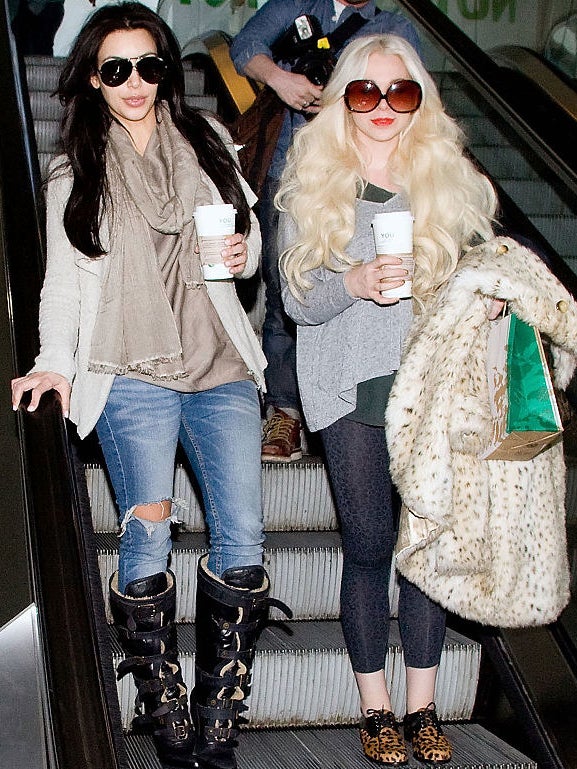 kim kardashian and a friend wearing oversized glasses