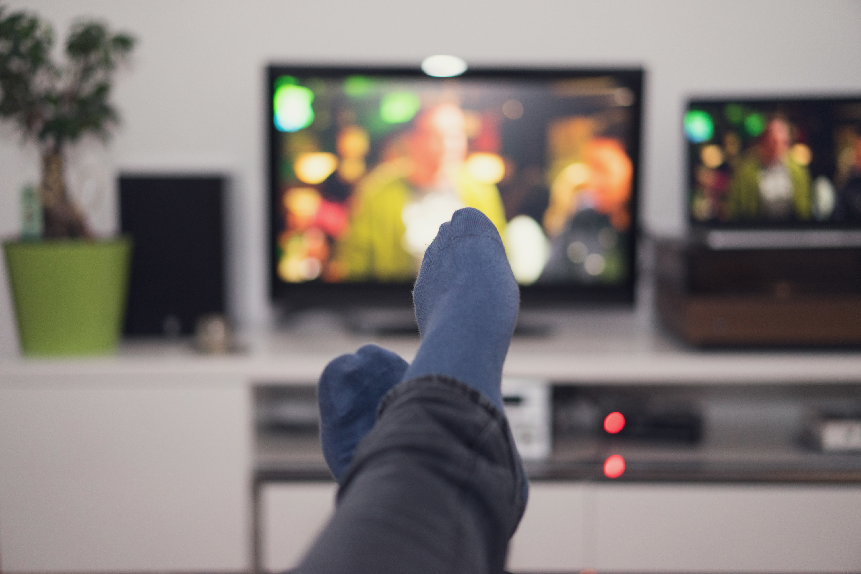 feet in front of a tv