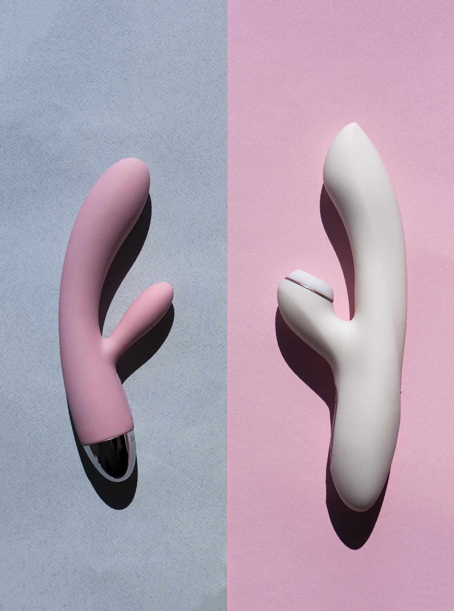 Stock photo of two sex toys on pink and gray backrgound