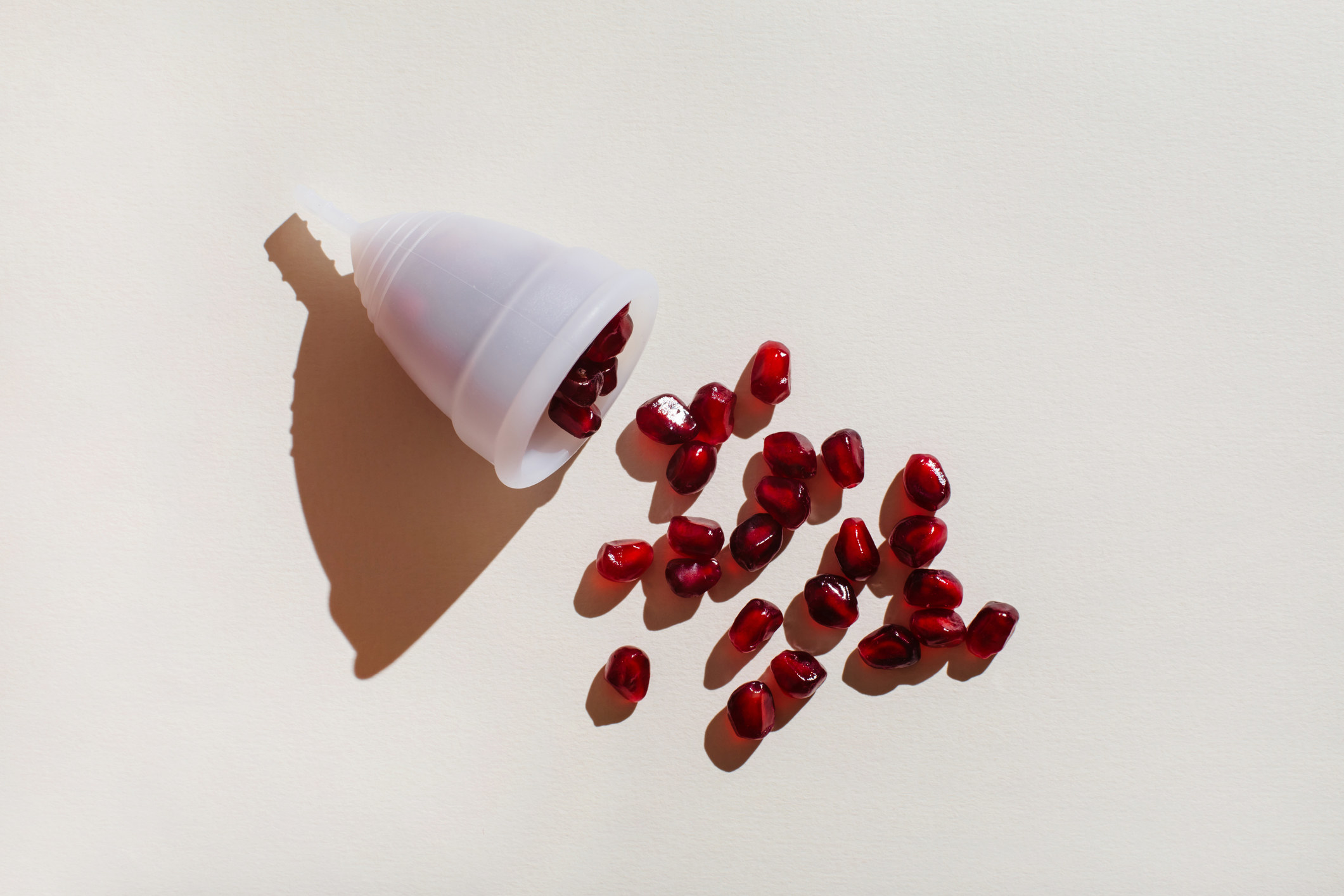Pomegranate seeds pour out of the menstrual cup