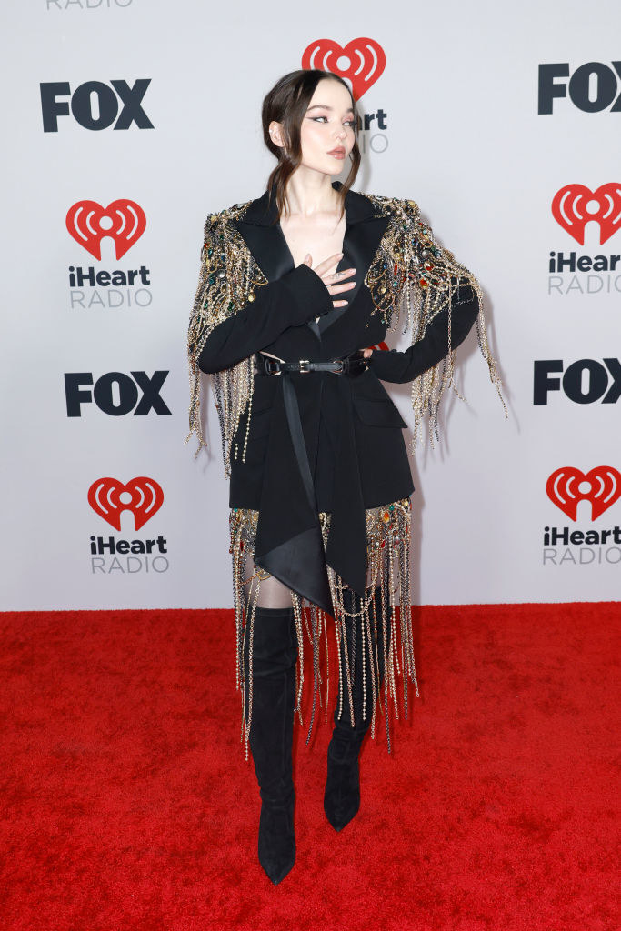 on the red carpet in the beaded fringe blazer and thigh-high boots
