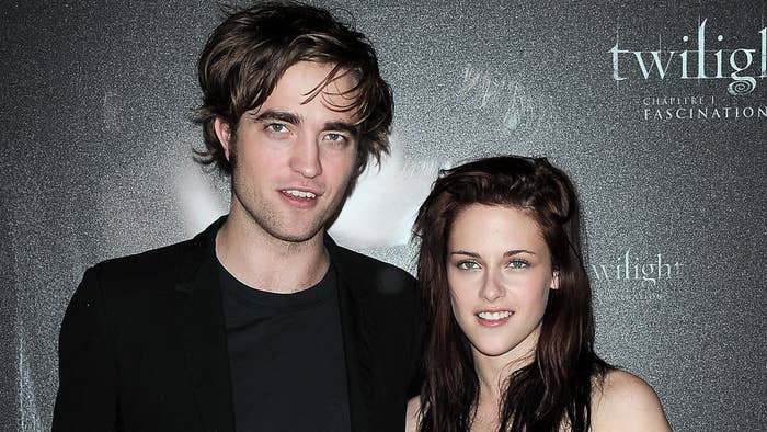 Photo of Robert Pattinson and Kristen Stewart at an event.