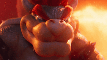 Bowser laughing an evil laugh in his lava-filled lair