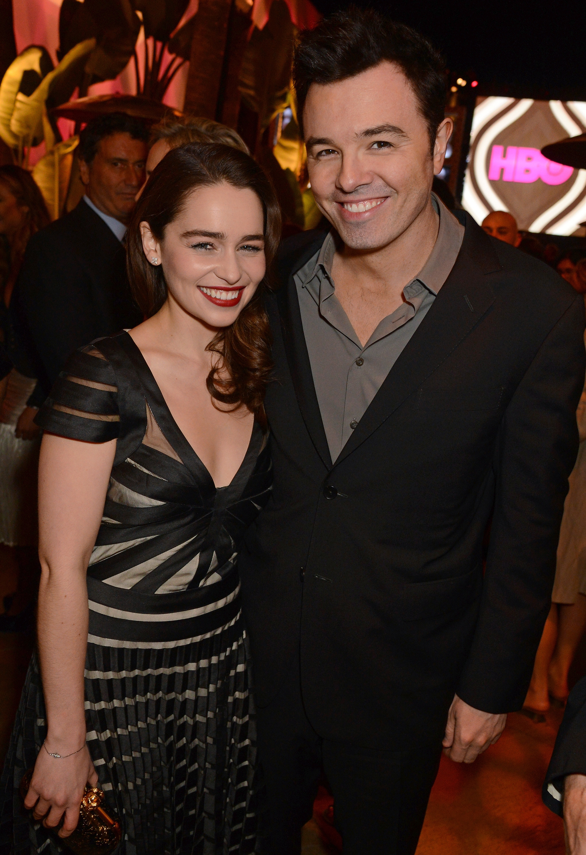 Seth MacFarlane and Emilia Clarke posing together at an event, they&#x27;re both wearing formalwear and smiling