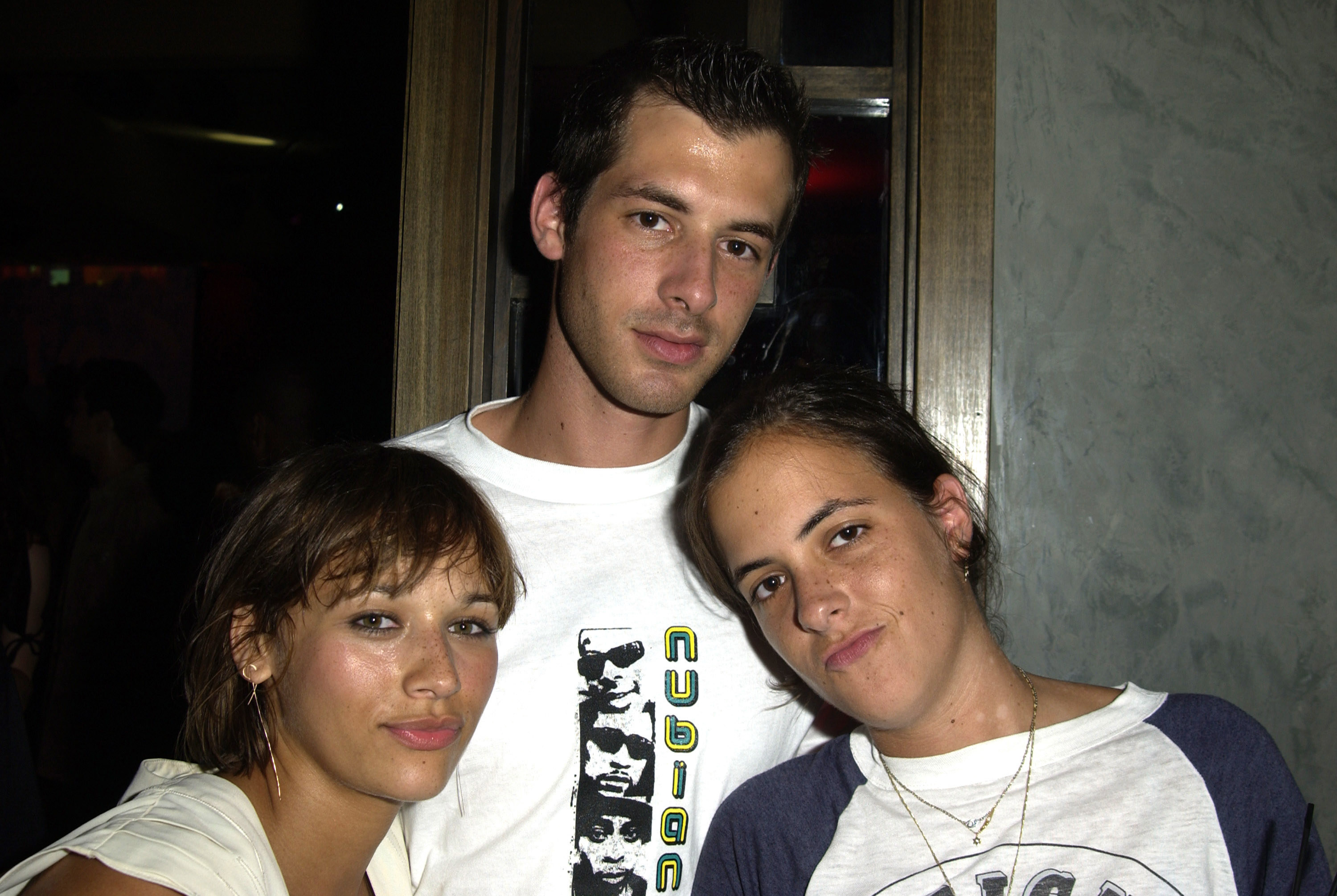 An old photo of Mark Ronson and Rashida Jones posing with his sister Sam Ronson