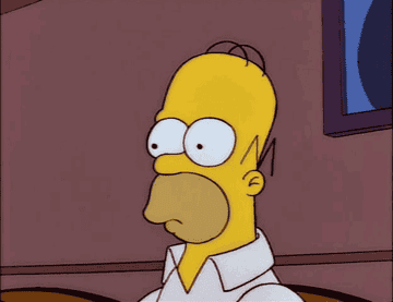 A GIF of Homer Simpson looking confused and blinking