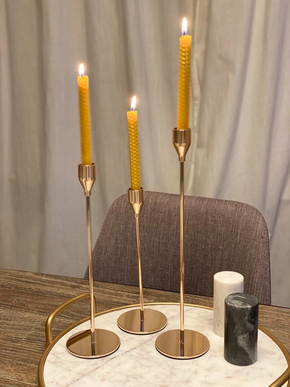 The candle sticks on a tray