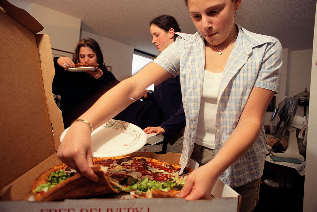 Young people with a pizza pie