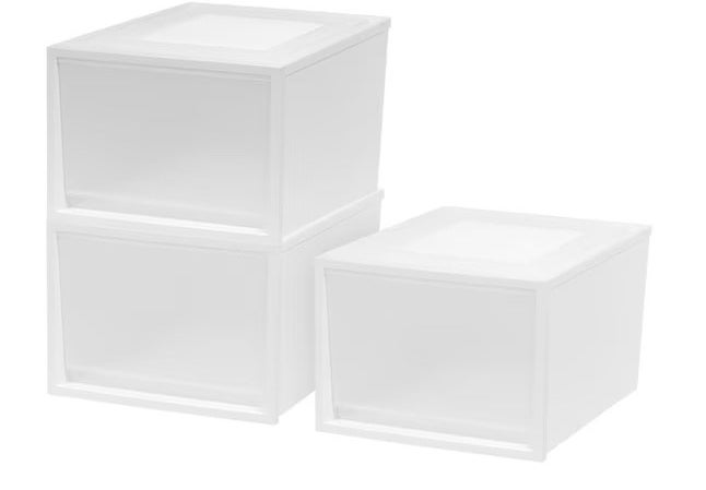 three white storage bins stacked
