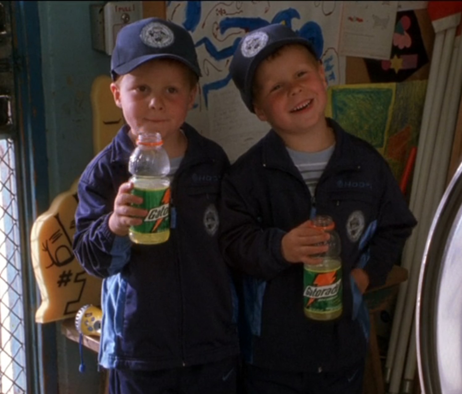 Nigel and Kyle Baker drink Gatorade in their dad&#x27;s office