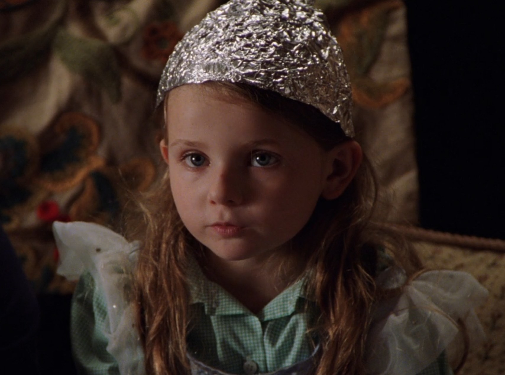 Abigail Breslin as Bo Hess wears a tin foil hat in &quot;Signs&quot;