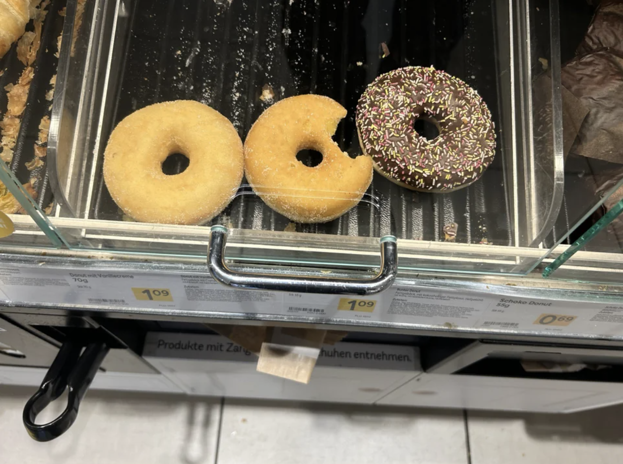 bite in the donut on the shelf
