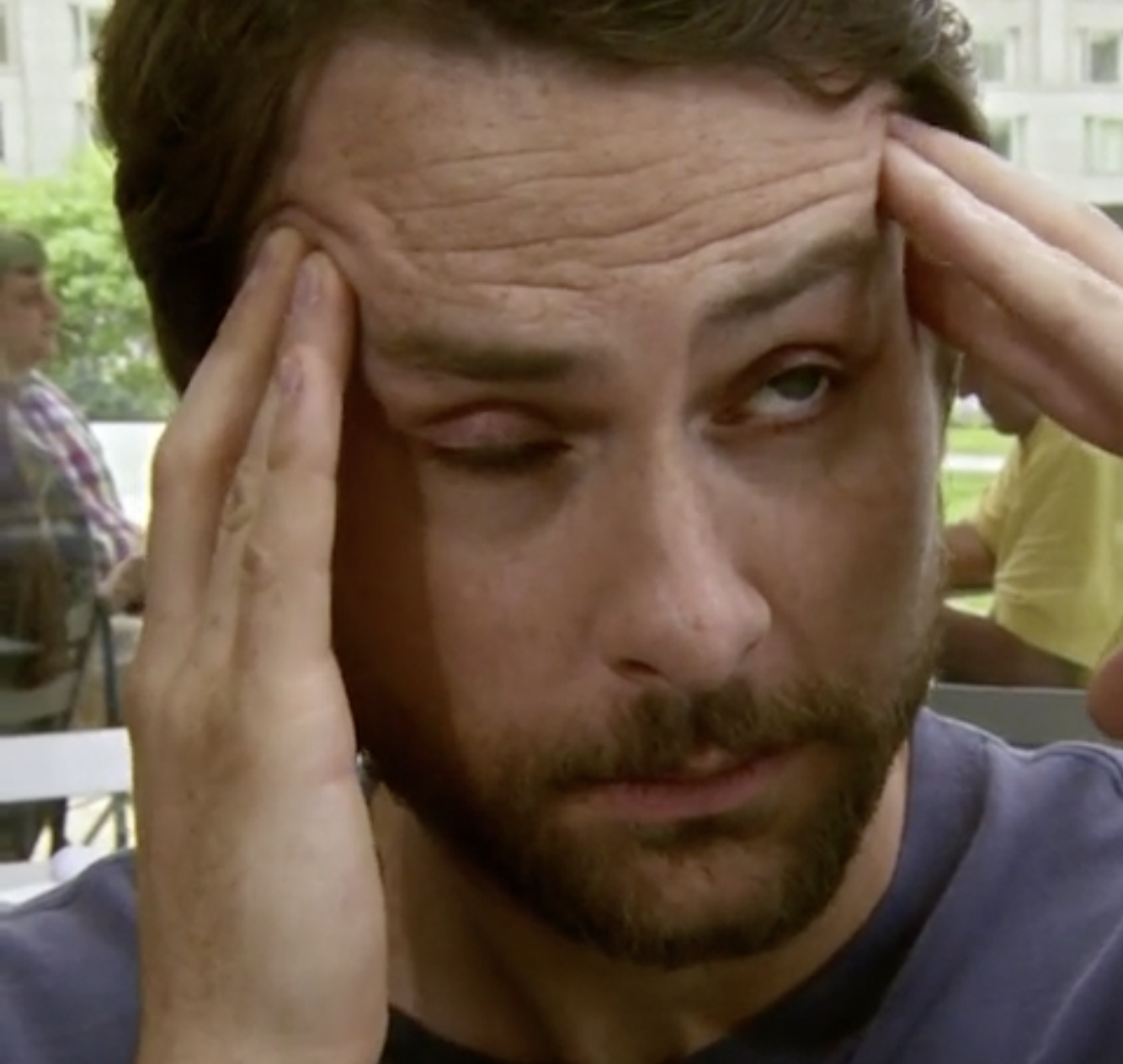 person holding their forehead