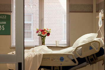 empty hospital bed is pictured