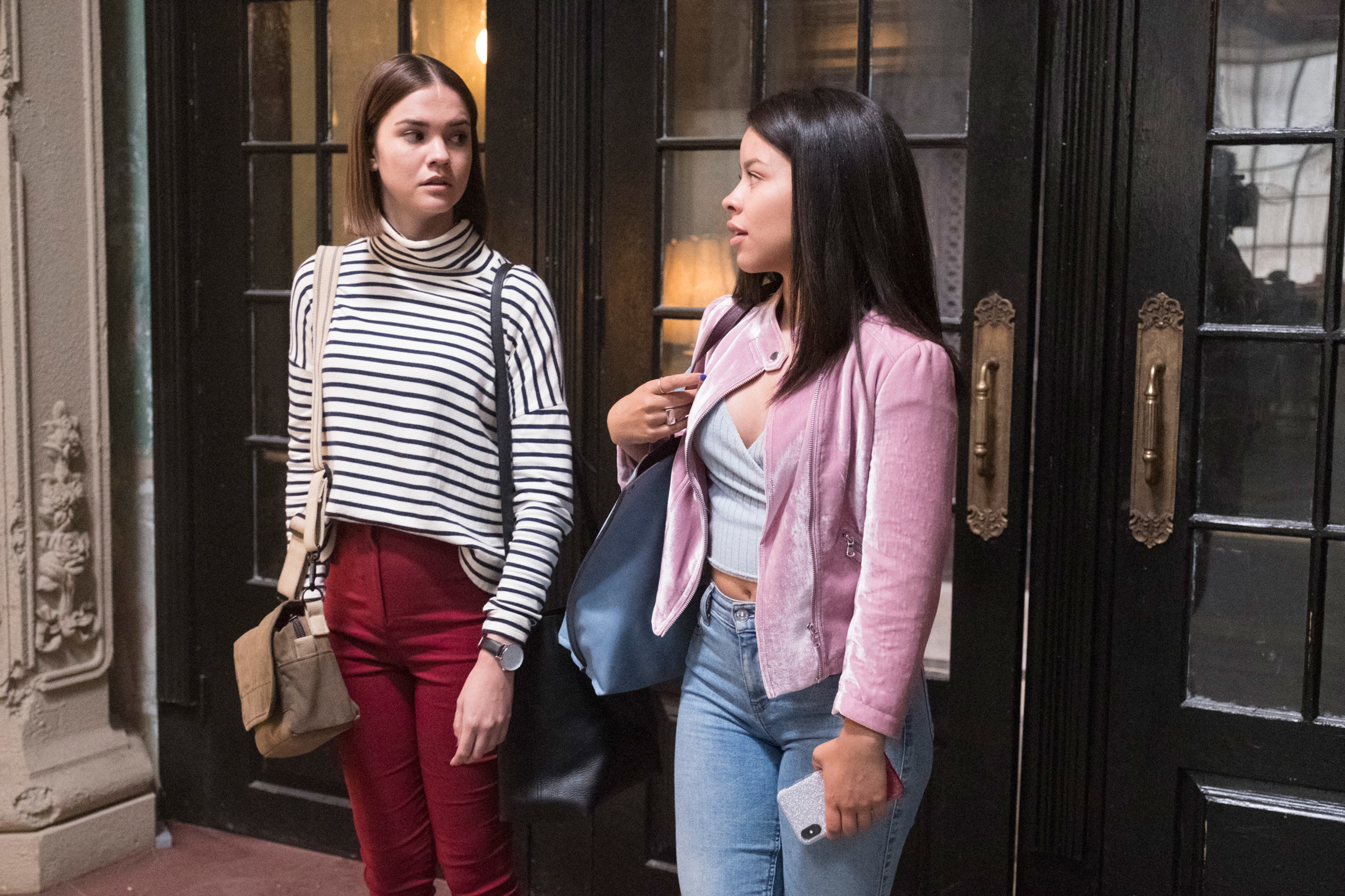 Maia Mitchell and Cierra Ramirez in Good Trouble, standing by a door