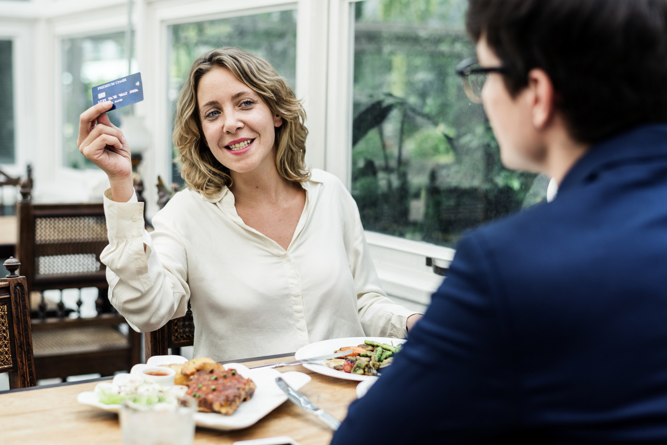 Woman paying for lunch