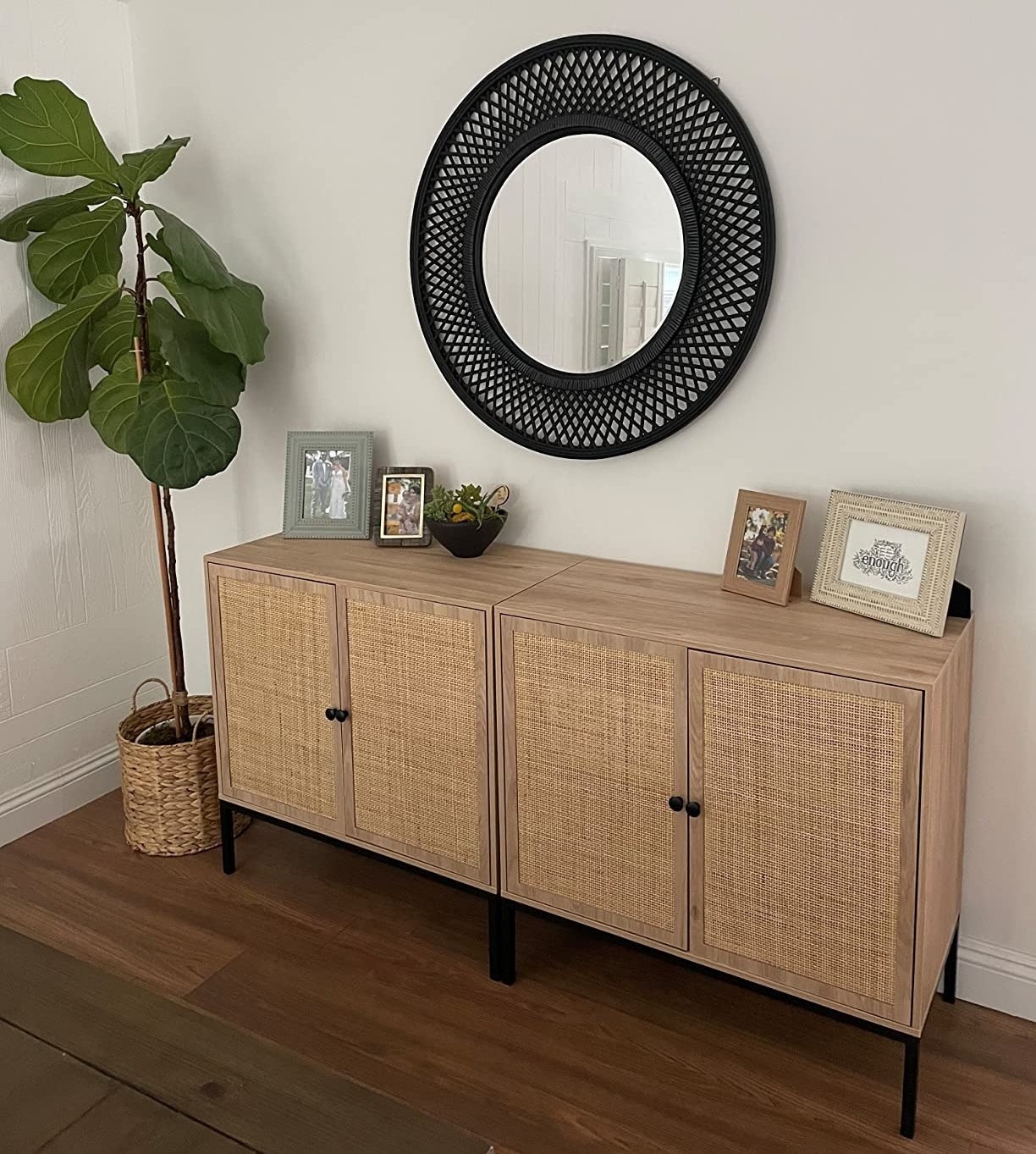 a reviewer&#x27;s photo of the sideboard under a mirror