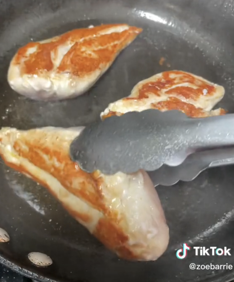 Turning seared chicken that&#x27;s golden brown on one side
