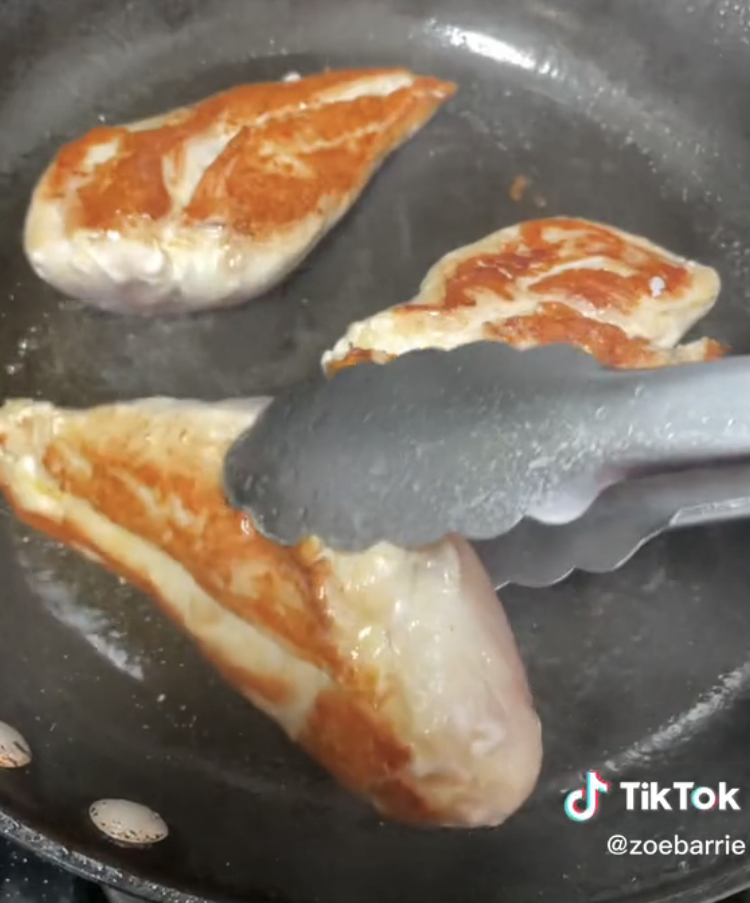 Turning seared chicken that&#x27;s golden brown on one side