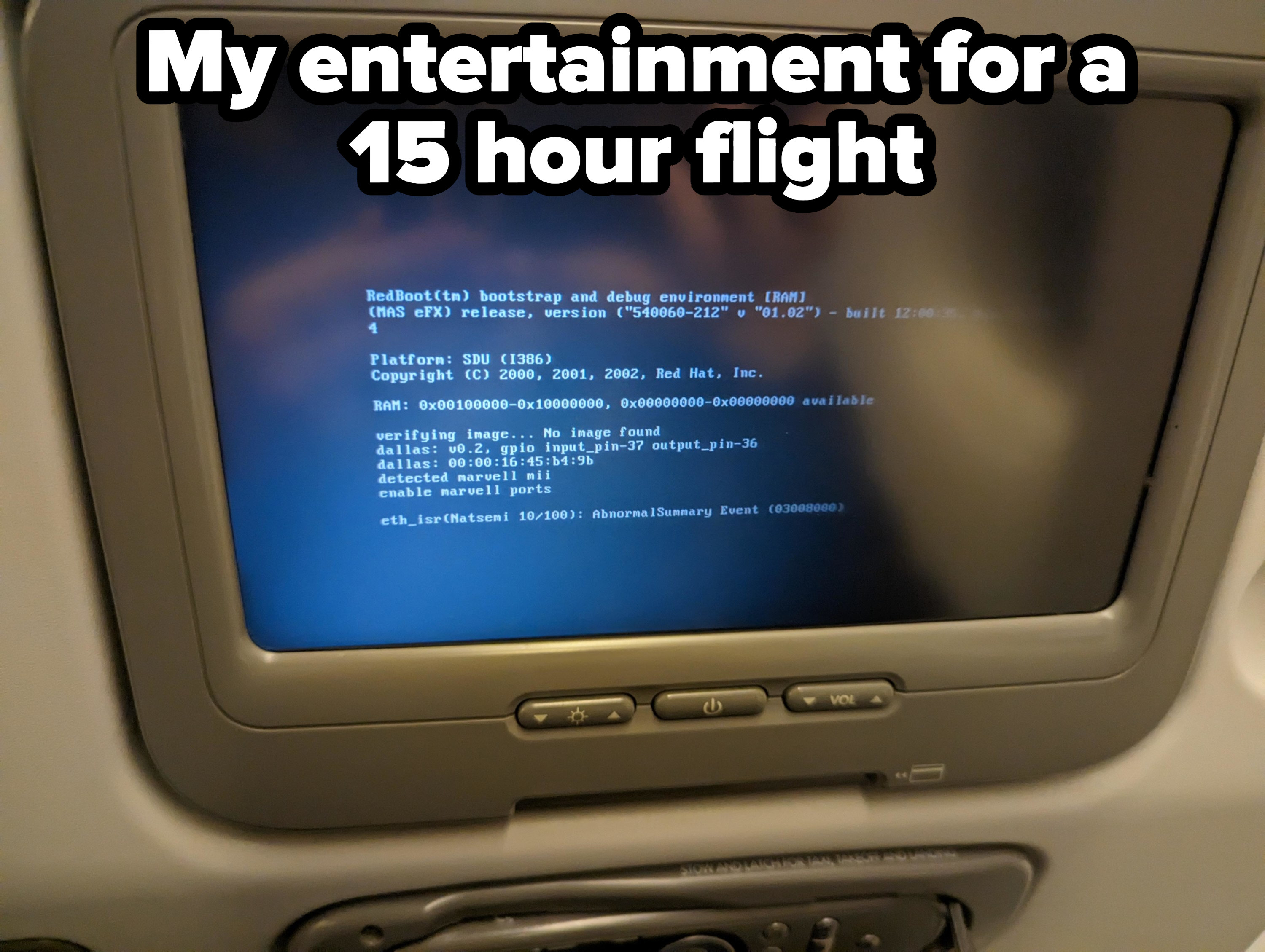 A computer command line and code instead of a movie shown on the back of the seat in front of them for their 15-hour flight