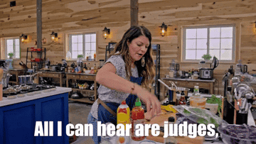 GIF of contestant on cooking show cooking and saying, &quot;All I can hear are judges saying salt, salt, season, salt&quot;