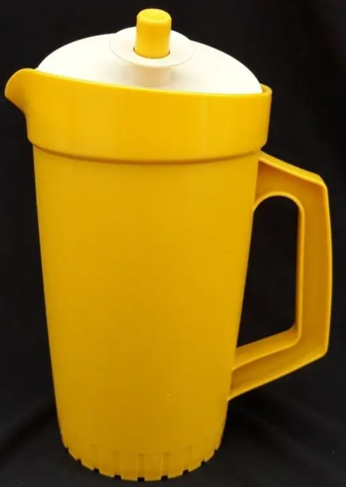 A yellow pitcher for juice or water