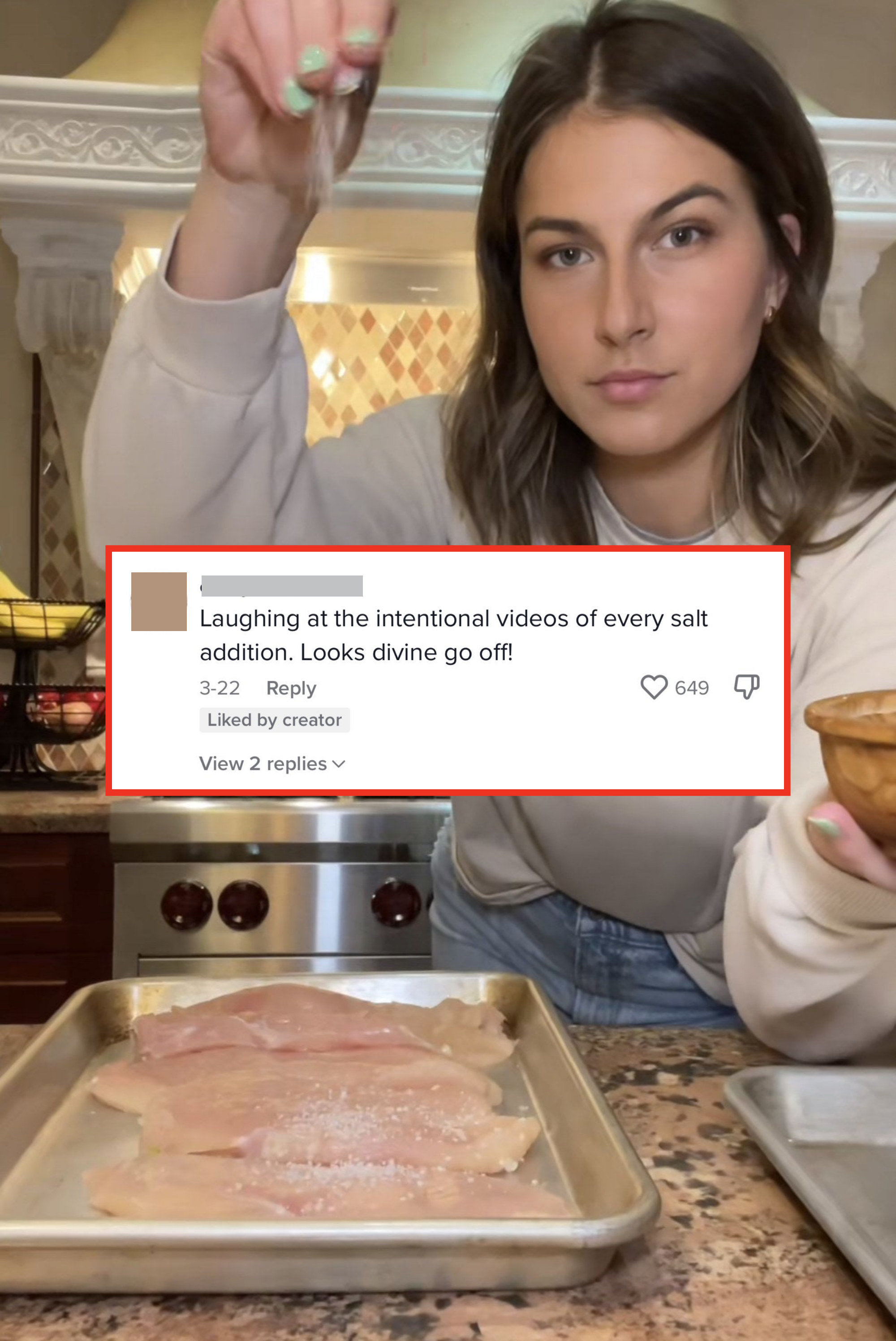 Zoe looking into the camera while sprinkling salt over raw chicken, with comment, &quot;Laughing at the intentional videos of every salt addition; looks divine go off!&quot;