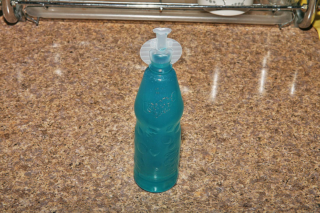 A blueberry Kool-aid burst twist-off bottle