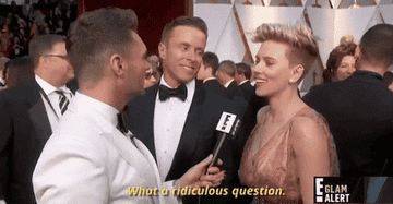 A GIF of Scarlett Johansson being interviewed on the red carpet, she&#x27;s saying &#x27;What a ridiculous question&#x27;