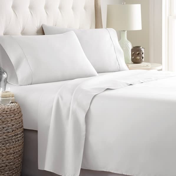 The sheets on a bed in white