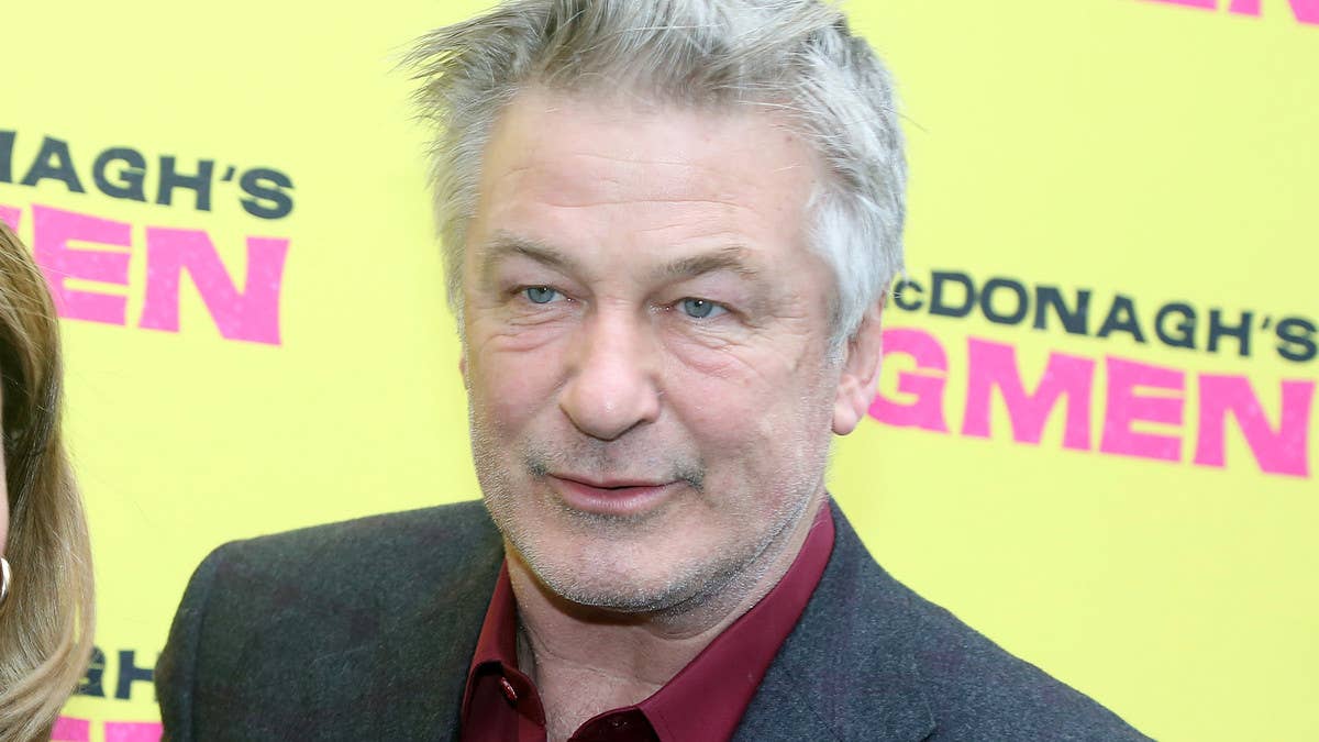 Alec Baldwin returned to the new 'Rust' set Friday, one day after involuntary manslaughter charges were dropped. Photos show him holding a gun backward.
