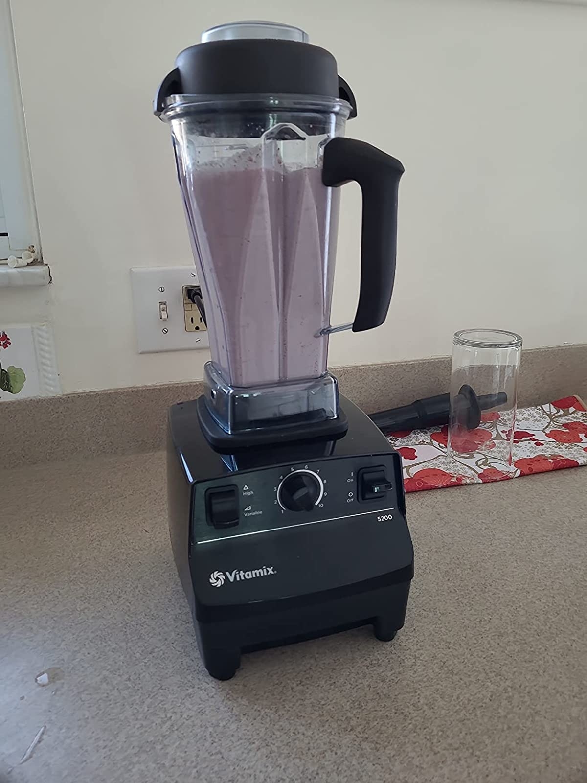 Reviewer&#x27;s blender with purple smoothie