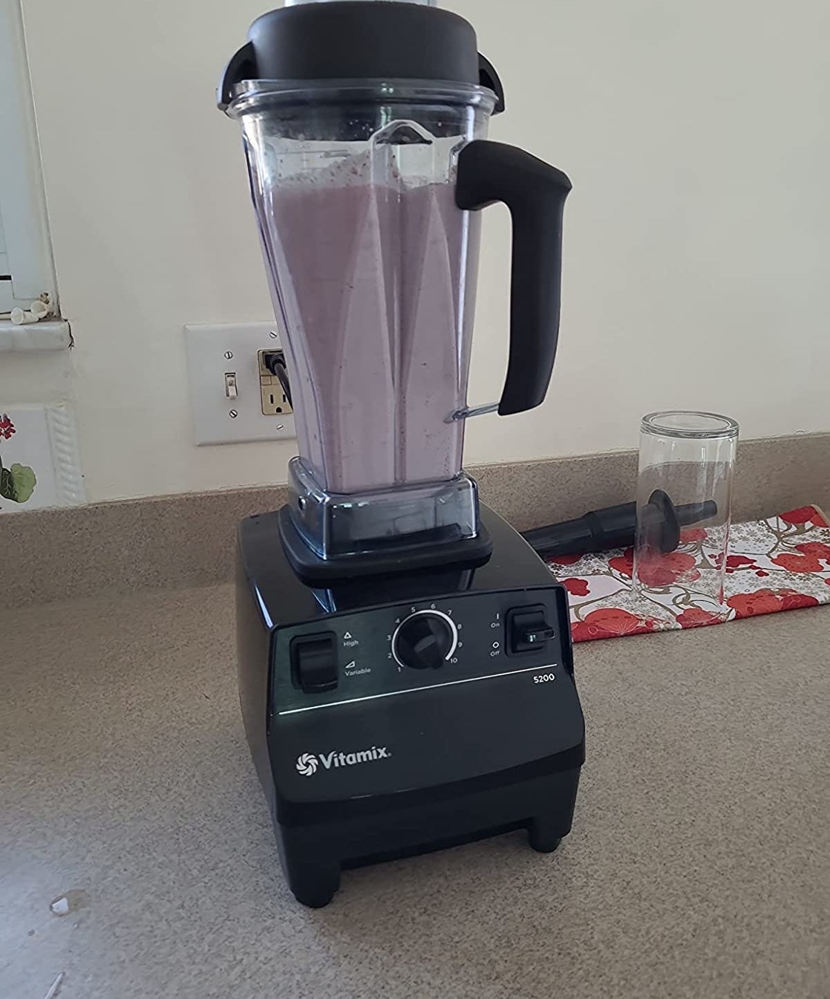 Reviewer&#x27;s blender with purple smoothie