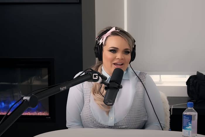 Trisha speaking into a studio microphone