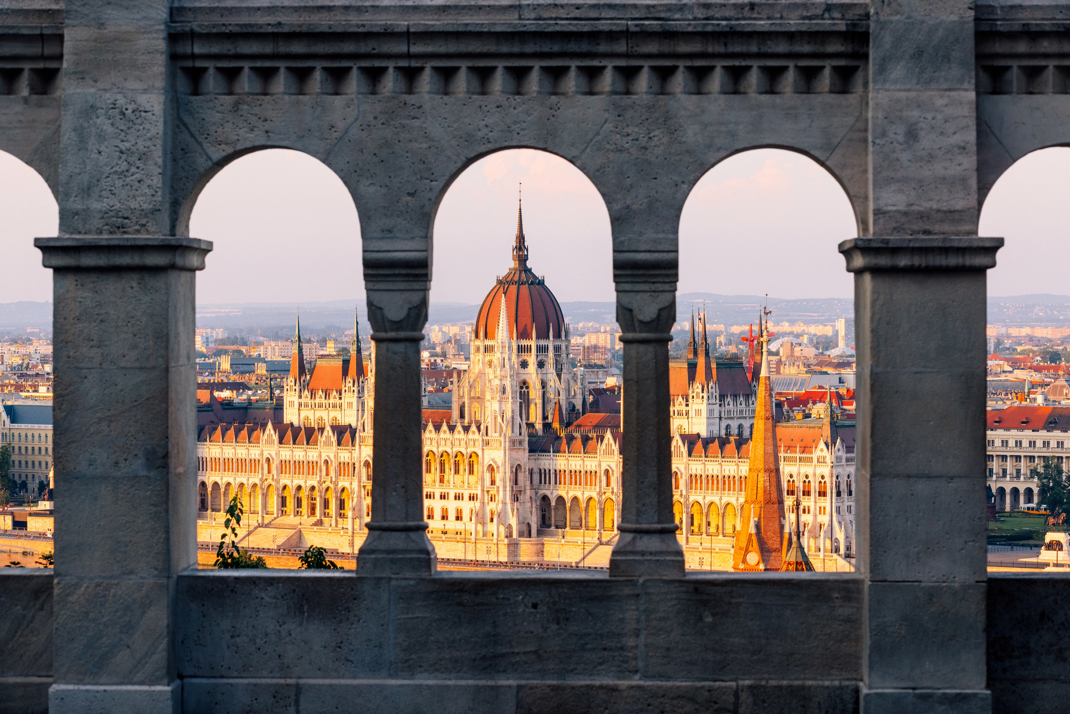 Hungarian Parliament seen through arches.