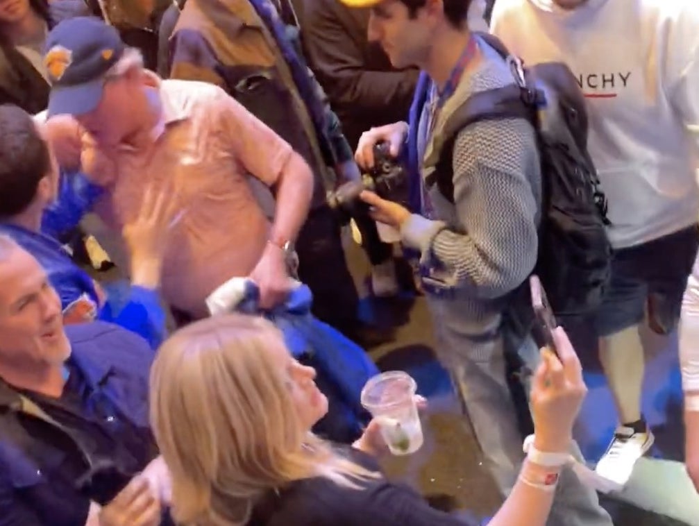 Pete pushing the man away