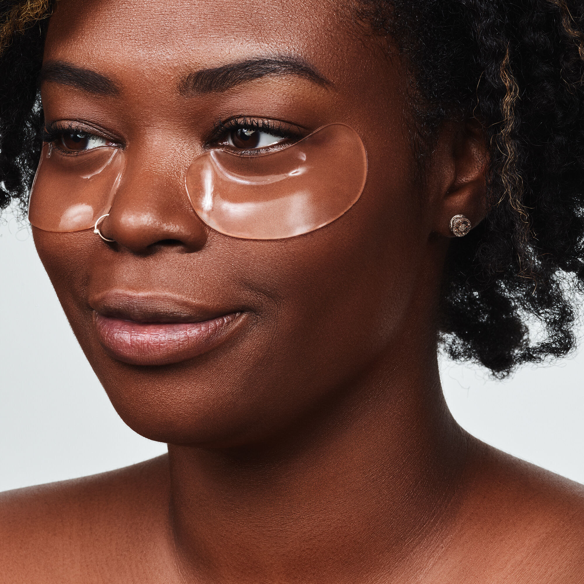 model wearing clear gel under eye patches