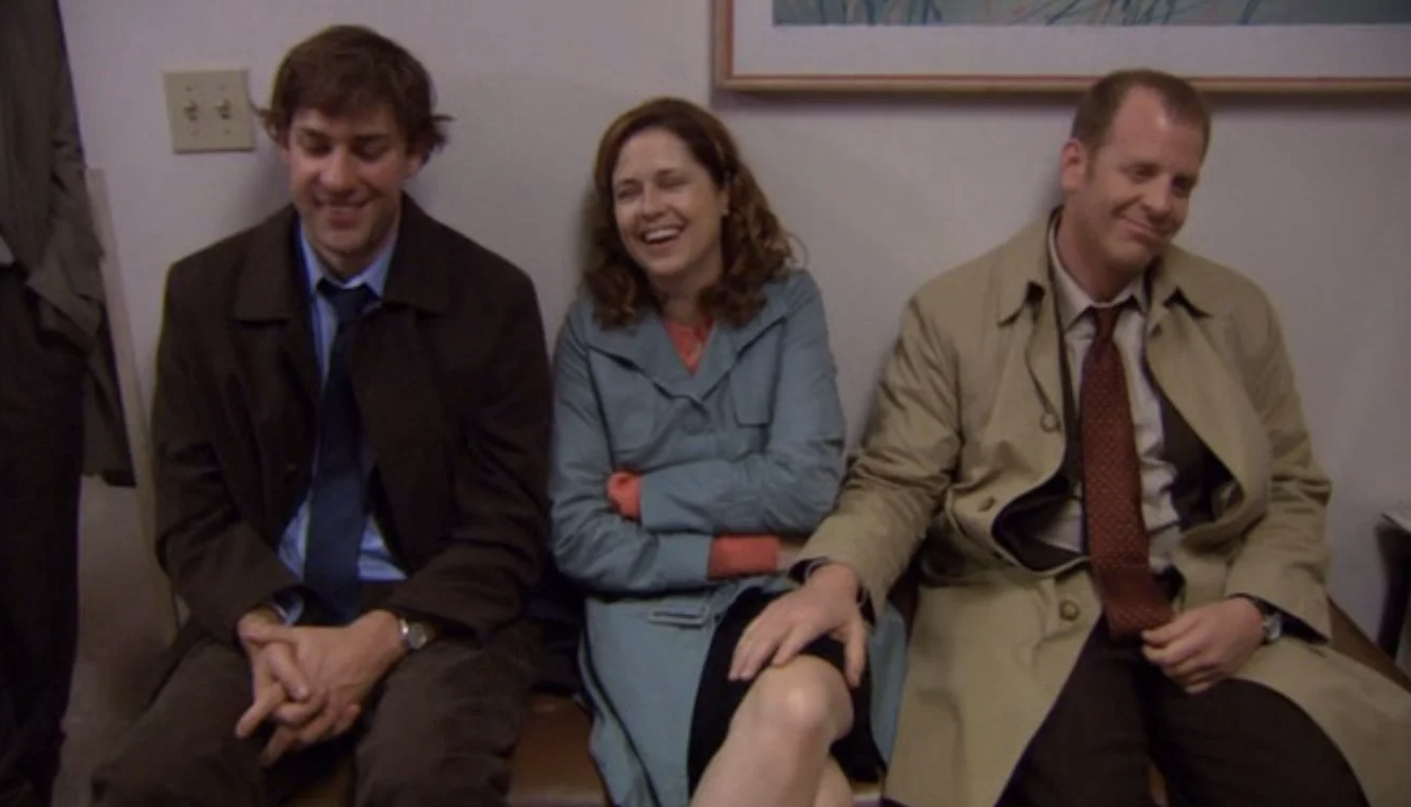 jim pam and toby sitting on a bench in dunder mifflin with toby&#x27;s hand on pam&#x27;s thigh