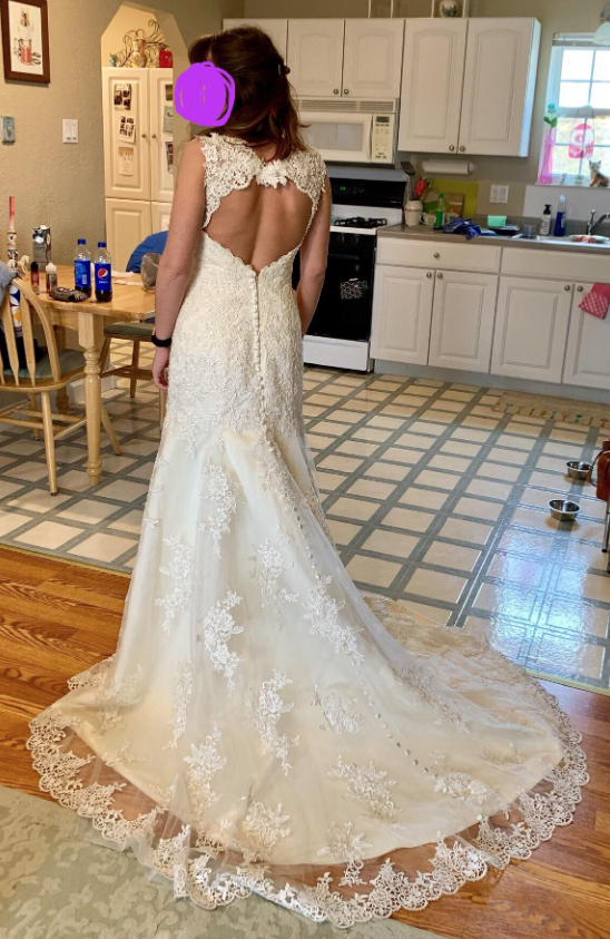 lacy wedding gown with a small train