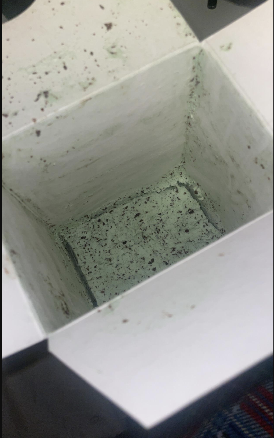 An almost empty ice cream carton