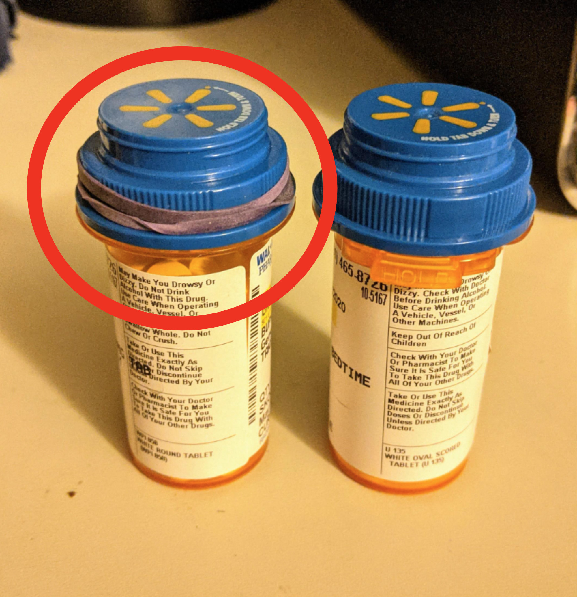 rubber band over a pill bottle